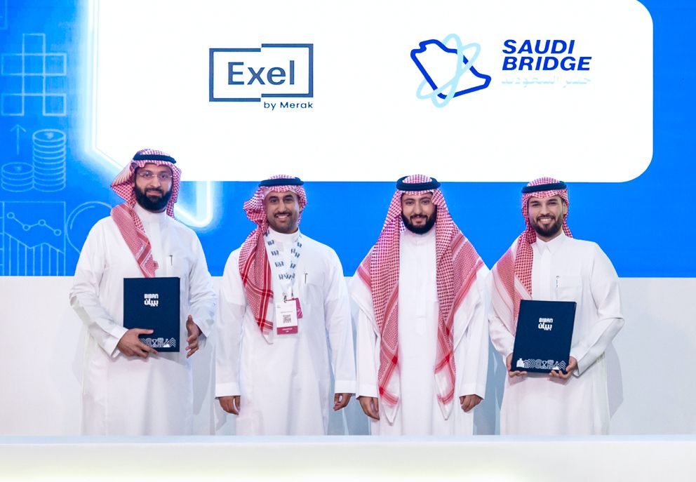 SaudiBridge and Exel by Merak representatives marking their partnership